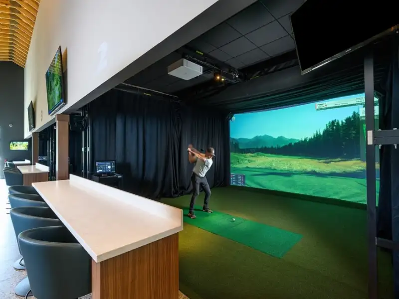 Indoor golf simulator bay